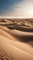 A vertical shot of smooth sand dunes with soft ridges, set against an expansive sky, providing clear room for text. photo
