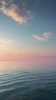 A vertical composition of a smooth gradient on the horizon, blending soft colors to create a tranquil, open background. photo