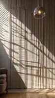 A peaceful background of a textured wall with gentle sunlight streaming through blinds, casting vertical shadows and providing space for text. photo