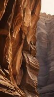 A vertical photo capturing the intricate details of a canyon wall with warm rock layers, providing clear space in the sky or textures for copy.