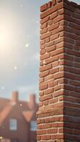 A high-detail shot of a brick chimney against a blank sky, creating a simple background for text placement. photo