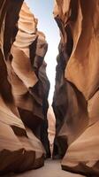 A detailed vertical photo of a canyon wall, showcasing layered rock formations in warm hues, and ample copy space in the blank sky or smooth textures.