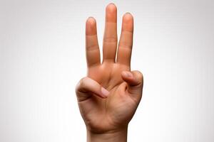 Child's hand showing the number 3 with fingers isolated on white background photo