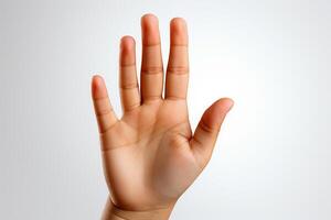 Child's hand showing the number 5 with fingers isolated on white background photo