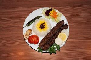 Turkish kebab plate with rice and salad. Retro flash food photography photo