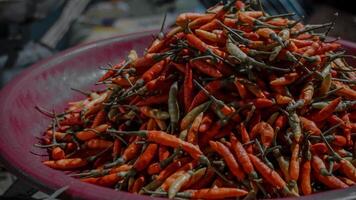 Pile of Red and Green Chili Peppers photo