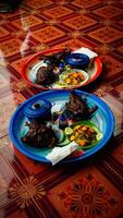 Traditional African Cuisine with Grilled Meat and Salads photo
