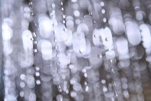 Abstract texture of water jets from the shower in close-up. photo