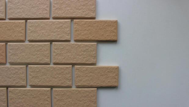 The process of laying facing tiles with a brickwork pattern stock photo for house renovation backgrounds