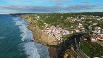 Azenhas do Mar Village on Sunny Day. Cliffs and Waves of Atlantic Ocean. Portugal. Aerial View. Moving Forward, Tilt Down video
