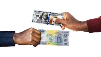 USA Dollar Central African CFA Franc currency pairing.Black African hands holding exchanging comparing two bank notes. USA versus CFA. Weighing Currencies against each other. Exchange rate photo