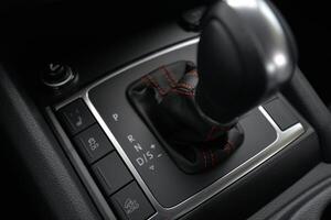 Close up of a modern car's gear stick and console Sleek design with intuitive controls photo