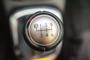 Close up of a six speed manual gear shift knob in a vehicle photo