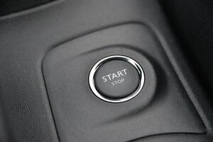 Close up of a car's start stop button Modern vehicle interior detail photo