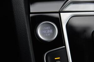 Close up of a car's start engine stop button photo