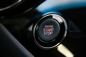 Close up of a car's engine start stop button Sleek modern design photo