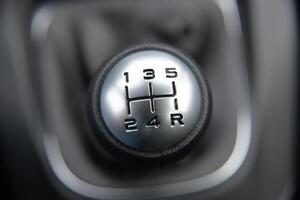 Close up of a manual car's gear stick Five speed transmission photo
