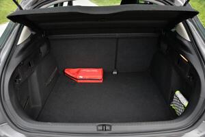 Empty car trunk with first aid kit and storage net photo