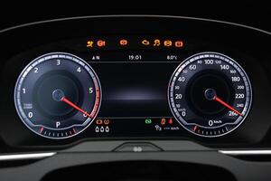 Car dashboard display showing speed RPM and warning lights photo