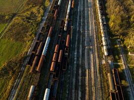 Aerial view of freight train cars parked on multiple railway tracks photo
