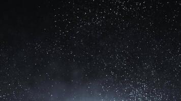 Animation of abstract glowing glitter particles. wave of bright dots and particles on a gray background. seamless loop. video