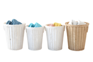 Collection of woven laundry baskets with pastel towels neatly folded for organized and stylish storage in a home setting png