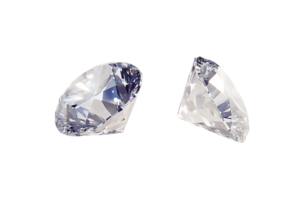 Close-up view of two sparkling diamonds showcasing brilliance and clarity against a dark background highlighting intricate cut and light reflection. png