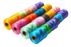 Brightly colored thread spools arranged in a row, showcasing various vibrant shades and patterns. png