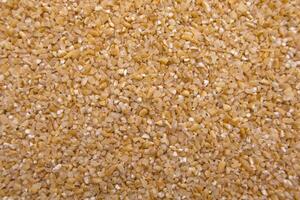 Full-Frame Close-Up of Broken Wheat Dalia - Cracked Wheat Texture Macro photo