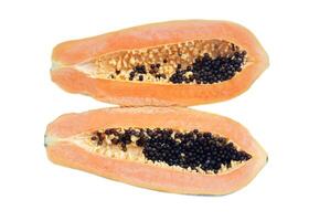 Half cut ripe papaya fruit with black seeds, isolated on white background. Concept, healthy tropical fruit with natural sweet. Delicious fruit with medicinal qualification. Good for health photo