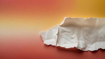 a red and yellow background with a torn piece of paper. photo