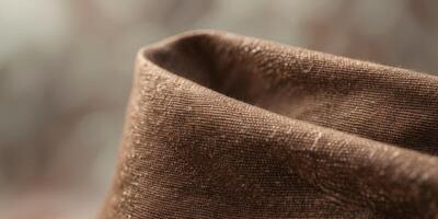 Textured Brown Canvas Fabric with Woven Design for Rustic BackdropTextured Brown Canvas Fabric with Woven Design for Rustic Backdrop. photo