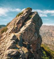 rocky sharp mountain ridge with a chasm photo