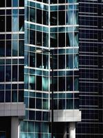 Abstract fragment of modern architecture, walls made of glass photo