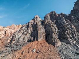 Abstract crumbling cliff rock formation. Eroding rock cliffs. photo