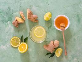 Antiviral drink with lemon, honey and ginger root photo