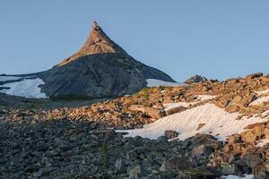 Steep eroded rough mountain peak. photo