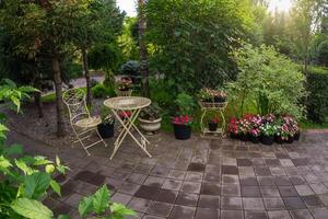 round wrought-iron table and chair of the garden photo