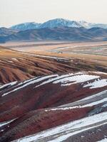 Unusual texture of the mountains, there is snow in the veins of the rock photo