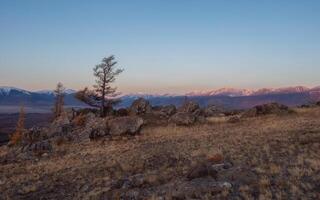 The ending light, mountains kissed by the sun late in the evening. photo