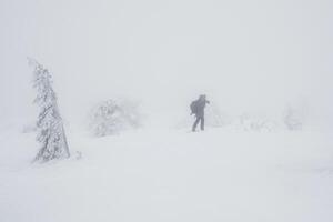 difficult weather conditions, a lone photographer photo