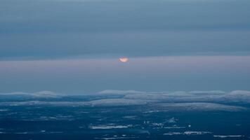 Moon partly hidden behind clouds. Part of the full moon photo