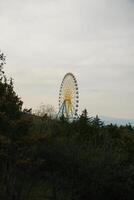Vertical view of ferris wheel on the mountain in Georgia photo