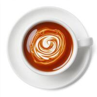 Hot beverage with intricate milk design served in a white cup on a circular plate at a cozy cafe photo