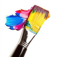 Colorful paintbrush with vibrant paint strokes on a clean surface showcasing artistic supplies for creative projects photo