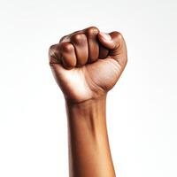 Fist raised in defiance symbolizing strength and unity during a peaceful protest or social movement photo