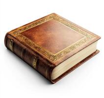 Leather bound book with intricate detailing on the cover resting on a white surface photo