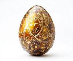 Decorative golden egg with intricate patterns displayed prominently against a simple background photo