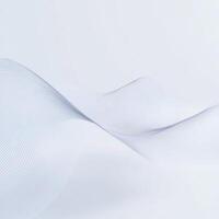 Flowing white fabric creates soft, gentle waves in a minimalist setting capturing serenity and tranquility photo