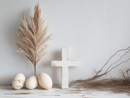 rústico monitor con huevos, pampa césped, y un de madera cruzar en un neutral antecedentes para Pascua de Resurrección decoración foto